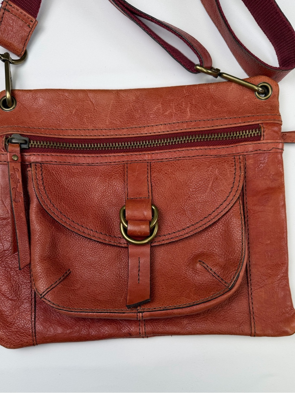 Gorgeously Distressed Fossil Orange/Red Leather Crossbody with Brass Ring Detail